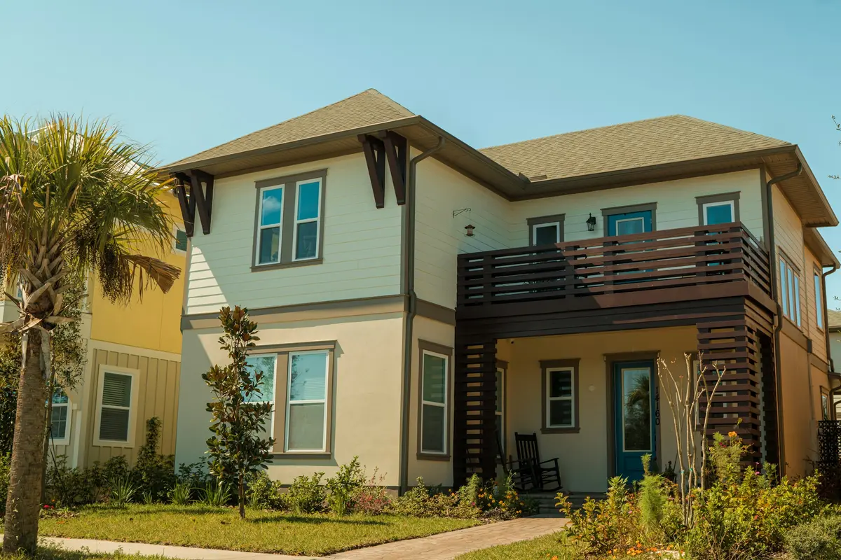 Two-story Florida home with a broad lawn and established landscaping